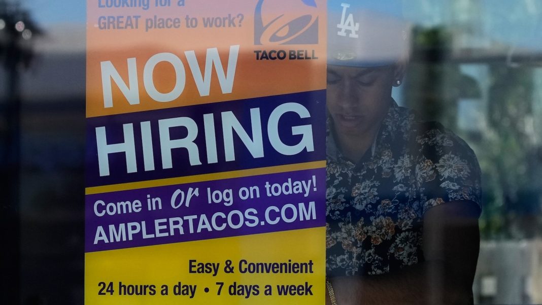 US jobless aid filings fell to 215,000 last week as layoffs remain low