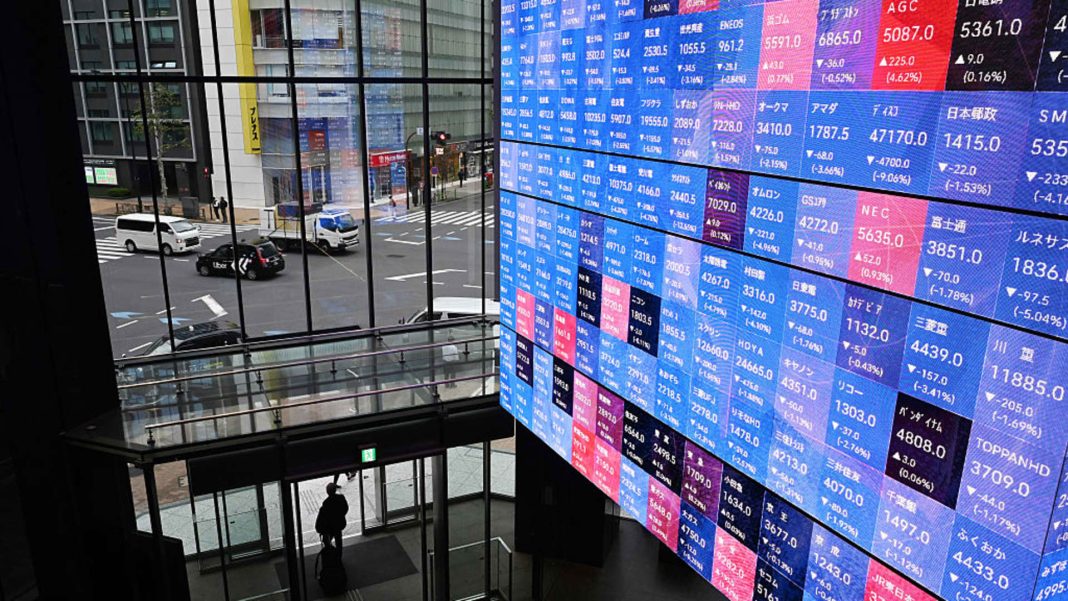 Japanese stocks rose as bond yields and the yen fell after rate hike